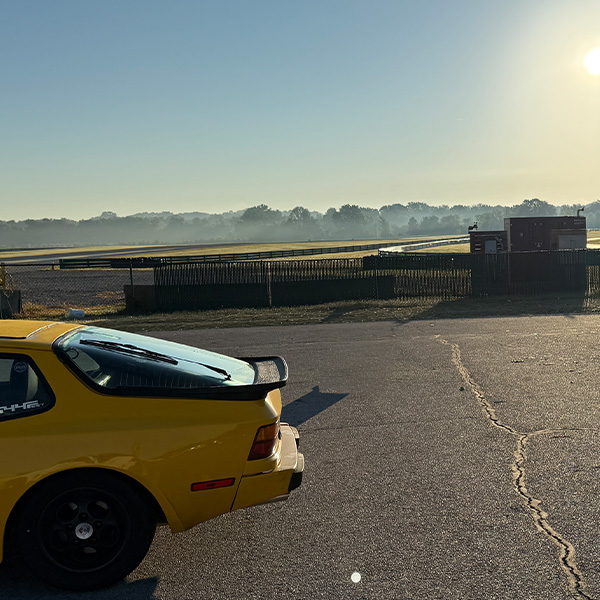 Yellow Porsche 944 at sunset