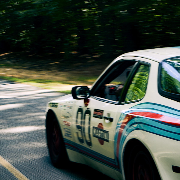 White Porsche race car with motion blur