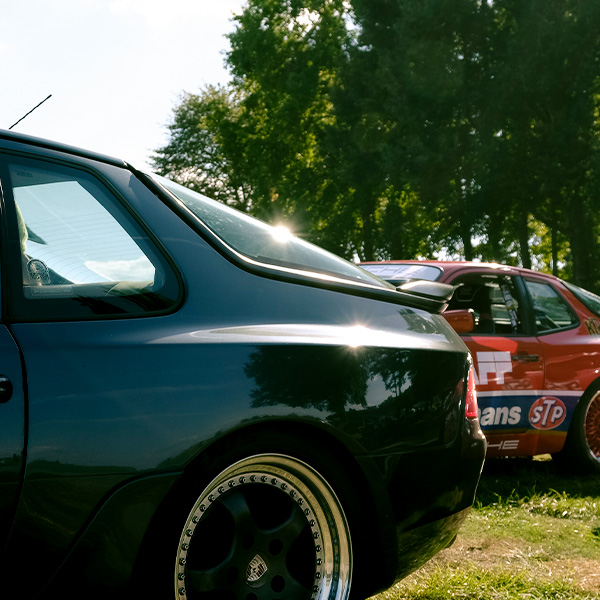 Teal Porsche 944 in field